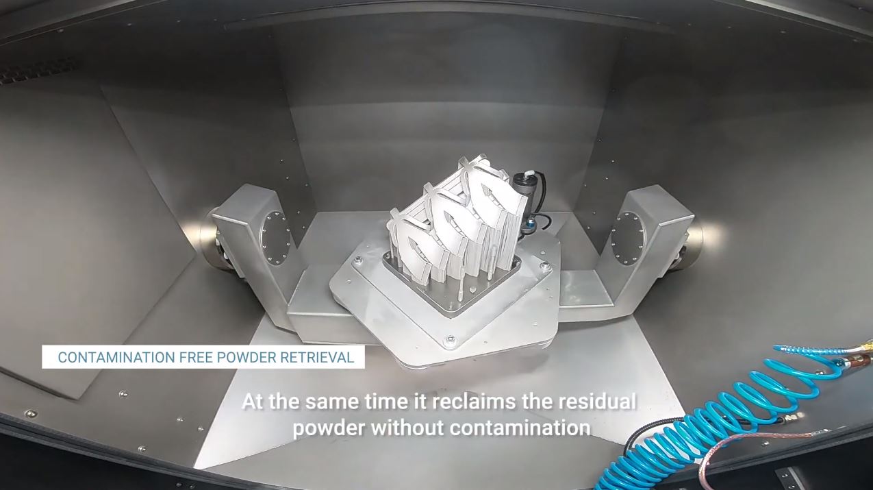 Automated de-powdering of a 3D printed aerospace part