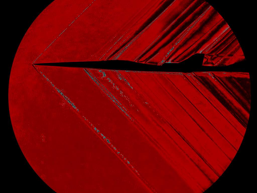 A schlieren image of the X-59 small-scale model captured inside NASA Glenn’s supersonic wind tunnel. These images are used to predict sonic booms and verify computer-based modelling