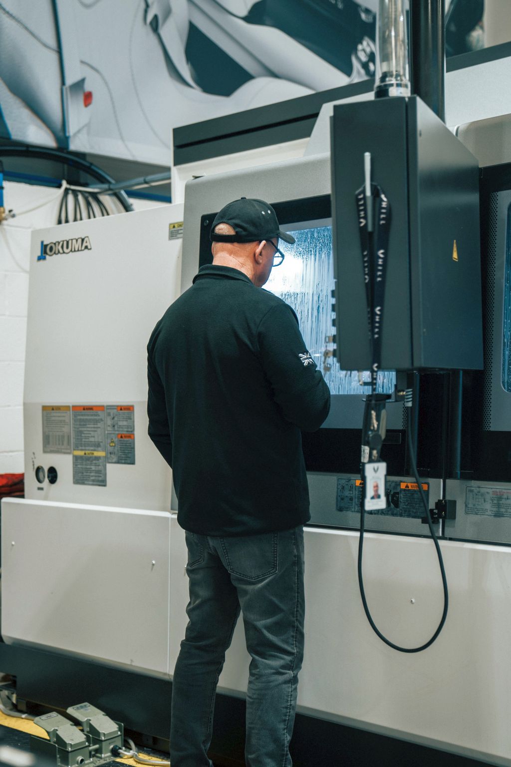 An Okuma GENOS 460V-5AX 5-axis VMC supplied by NCMT